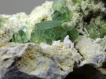 Andradite var. Demantoide - Antetezambato Demantoid-Topazolite Mine, Antetezambato, Maherivaratra Commune, Ambanja District, Diana Region, Antsiranana Province, Madagascar - Campione di 54.82x47.62mm con cristalli di Demantoide - € 70,00