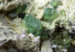 Andradite var. Demantoide - Antetezambato Demantoid-Topazolite Mine, Antetezambato, Maherivaratra Commune, Ambanja District, Diana Region, Antsiranana Province, Madagascar - Campione di 54.82x47.62mm con cristalli di Demantoide - € 70,00